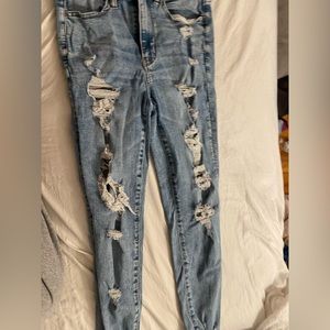 Blue ripped American Eagle Next Level Stretch jeans